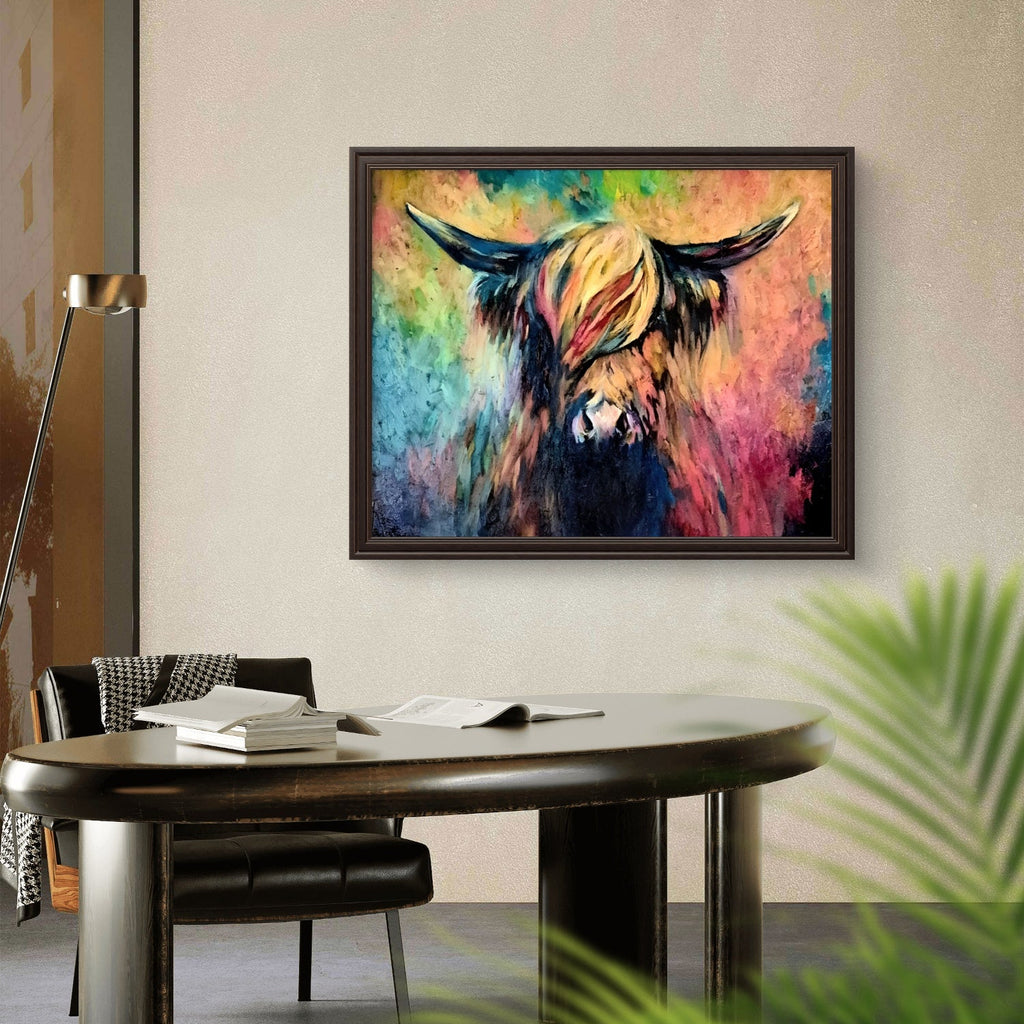 Colorful abstract painting of a bull on a wall above a desk.