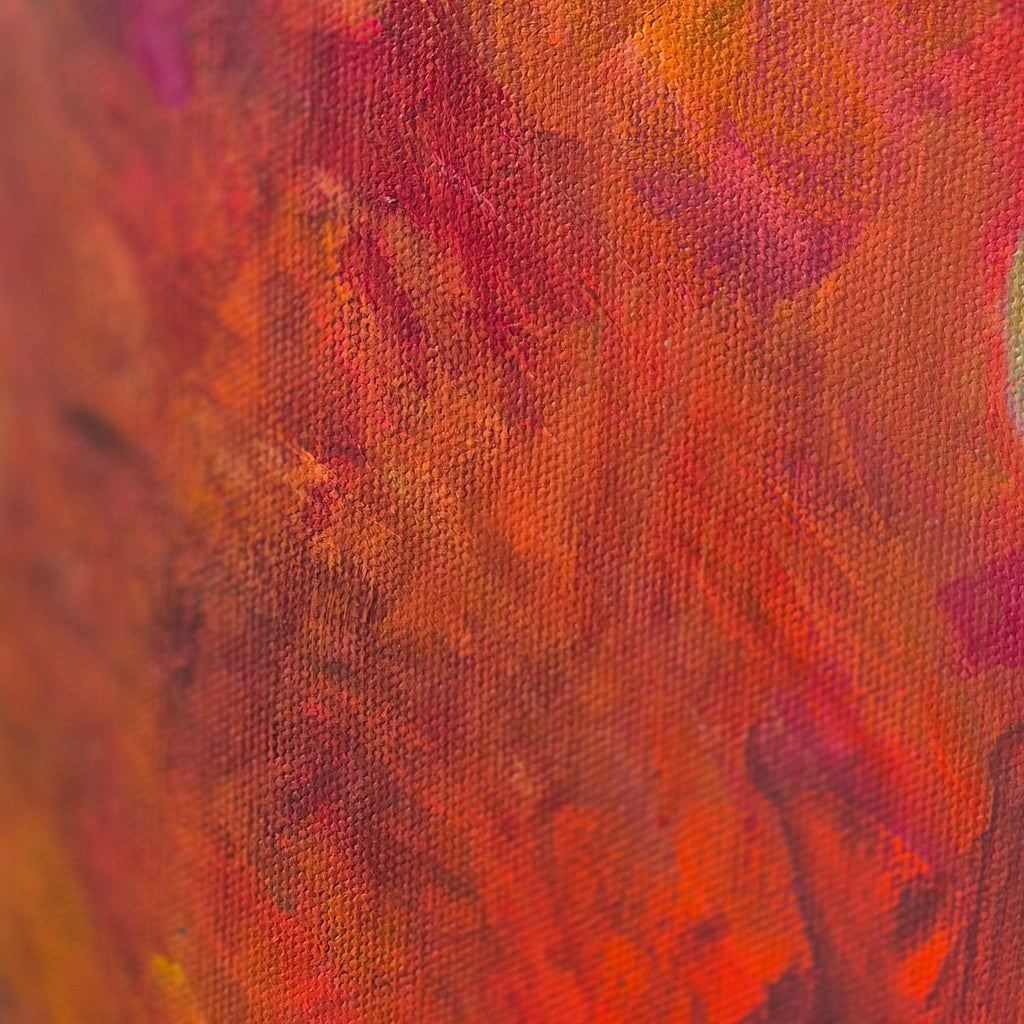 Close-up of textured horse painting with red and orange colors