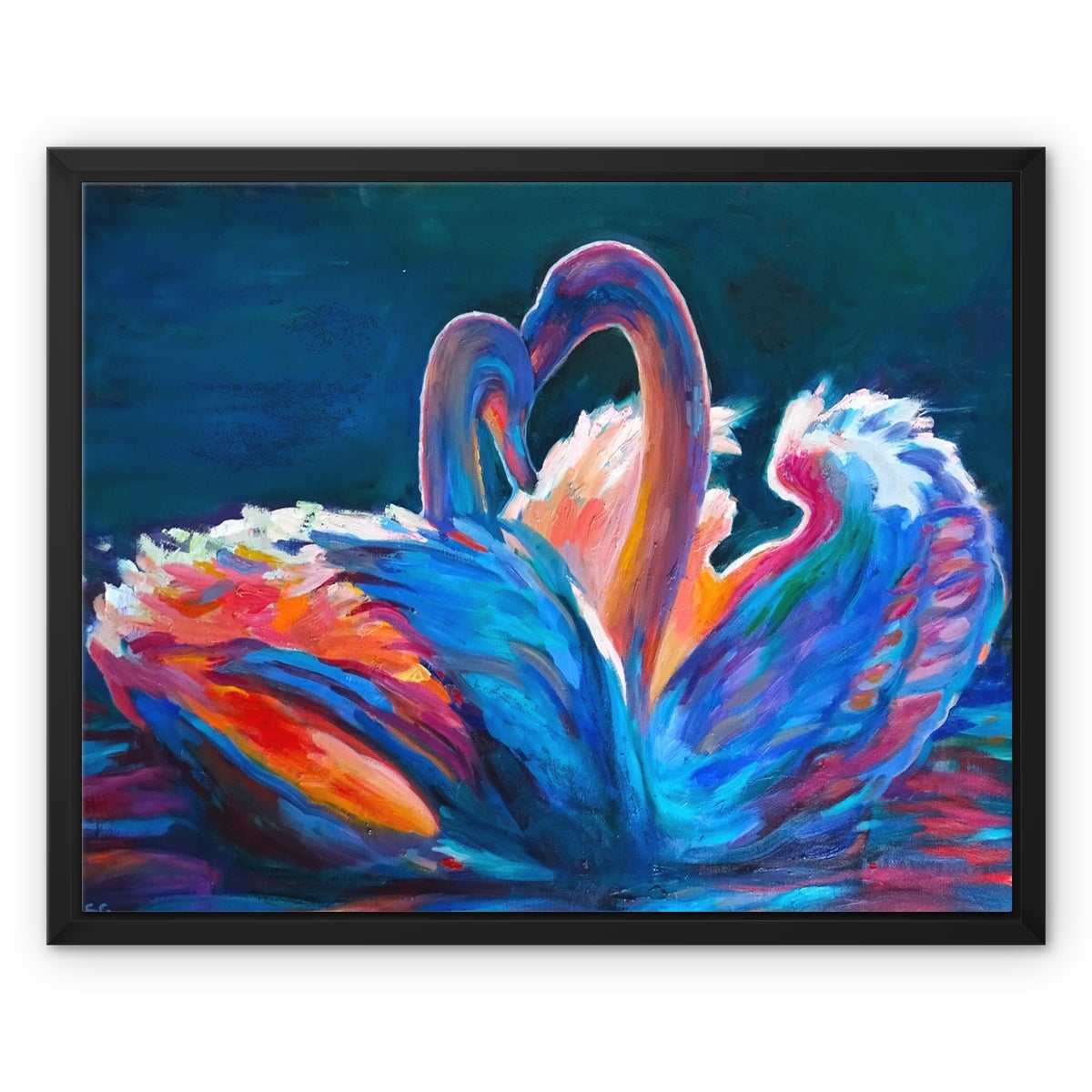 A framed painting of two swans facing each other, forming a heart shape with their necks. The artwork is painted in vibrant, expressive brushstrokes of blue, pink, orange, and purple against a dark teal background, housed in a simple black frame.