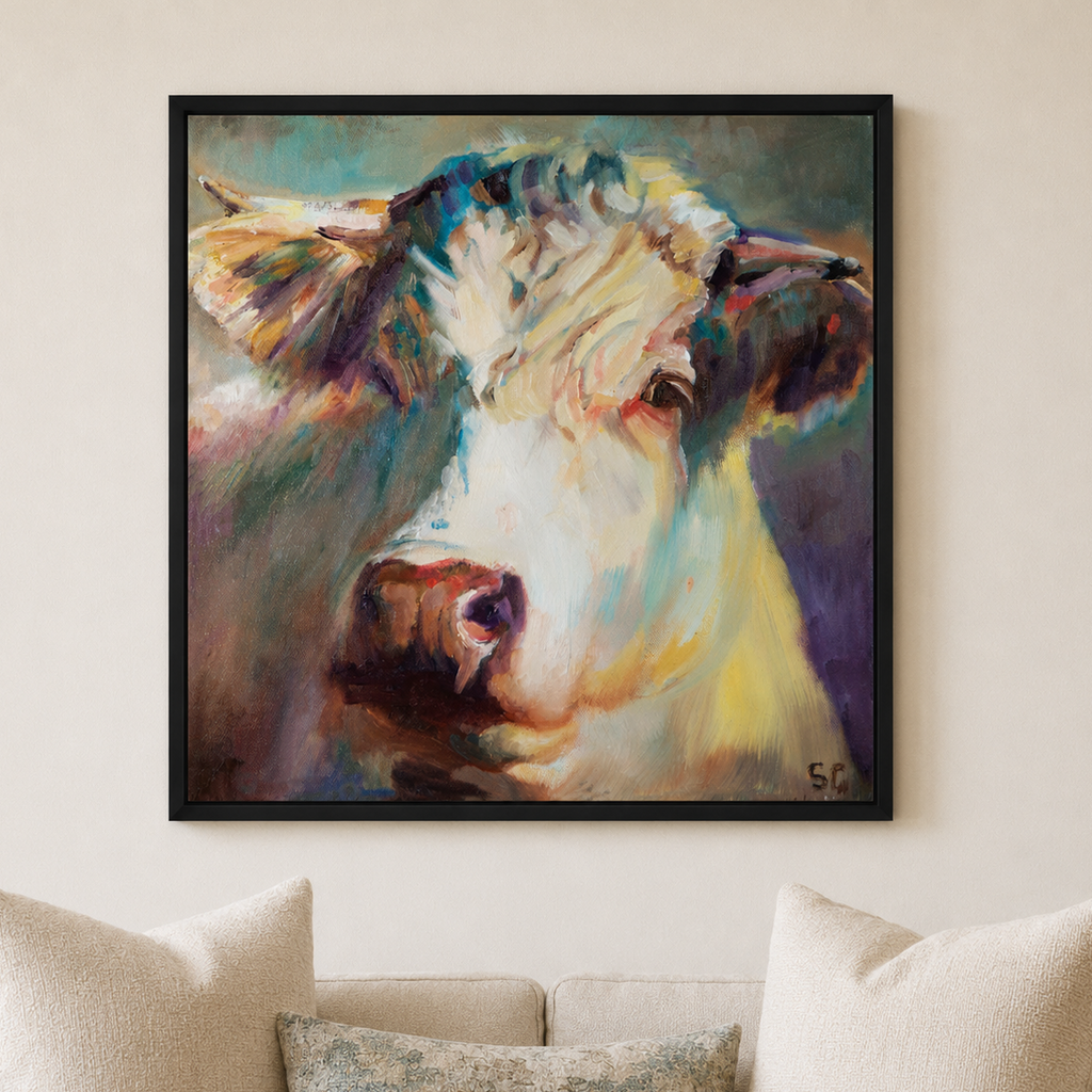 Creamy white cow wall art in a calm living room setting 