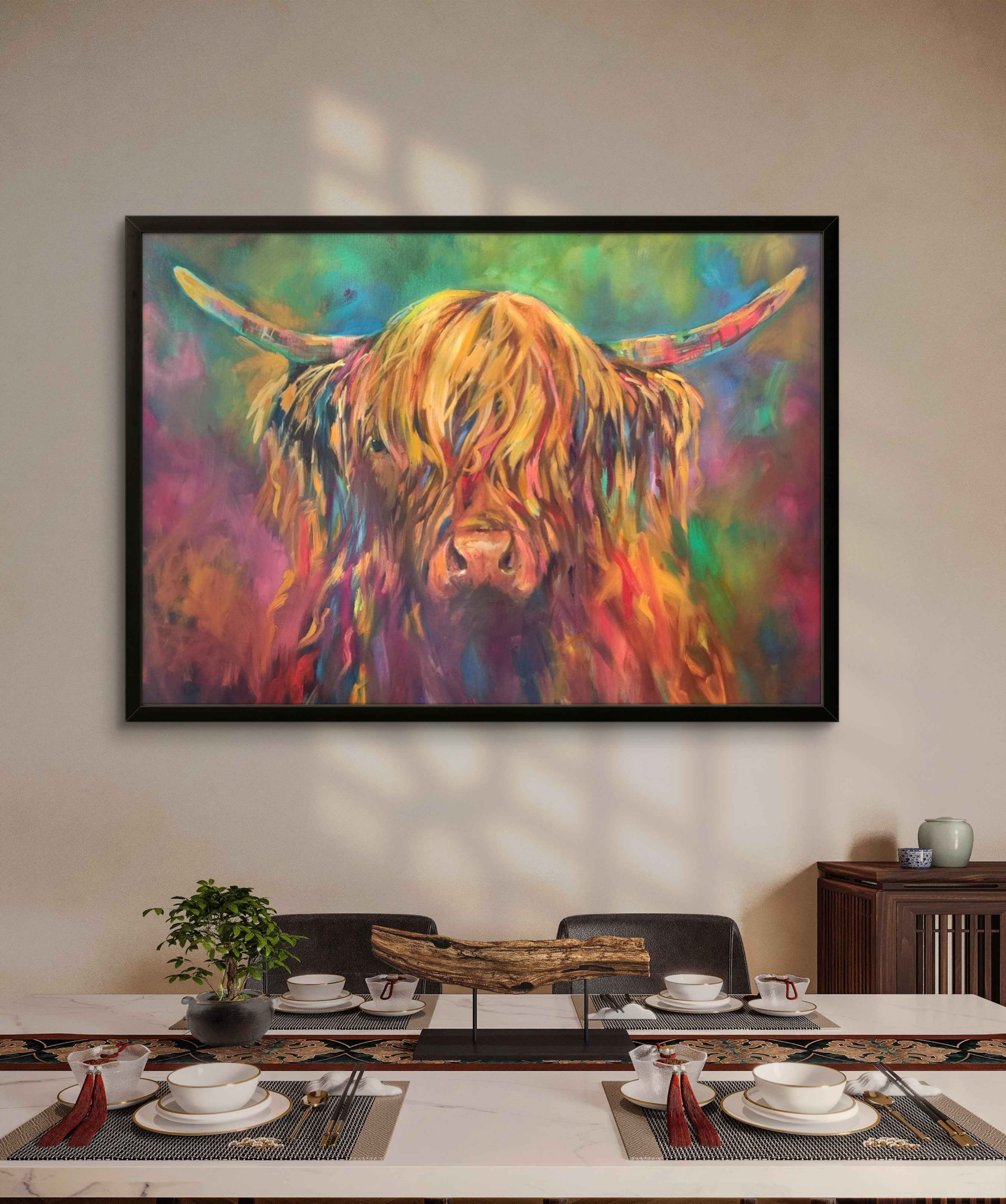Colorful painting of a highland cow on a wall above a dining table.