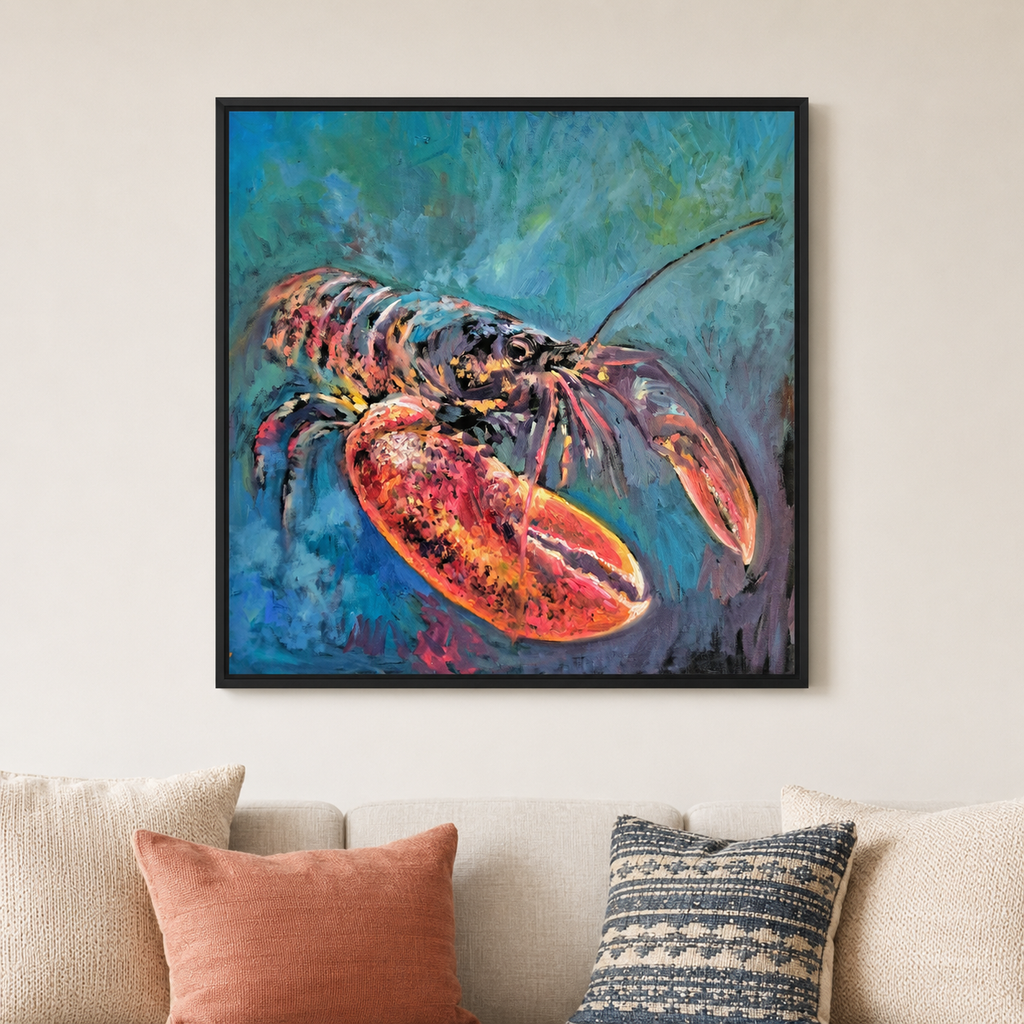 A framed square canvas painting of a lobster in vibrant blue, green, and orange-red tones, displayed on a beige wall above a sofa with decorative pillows.