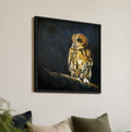 A framed canvas painting of a detailed owl perched on a branch, displayed on a light beige wall above a sofa with decorative pillows and vases.
