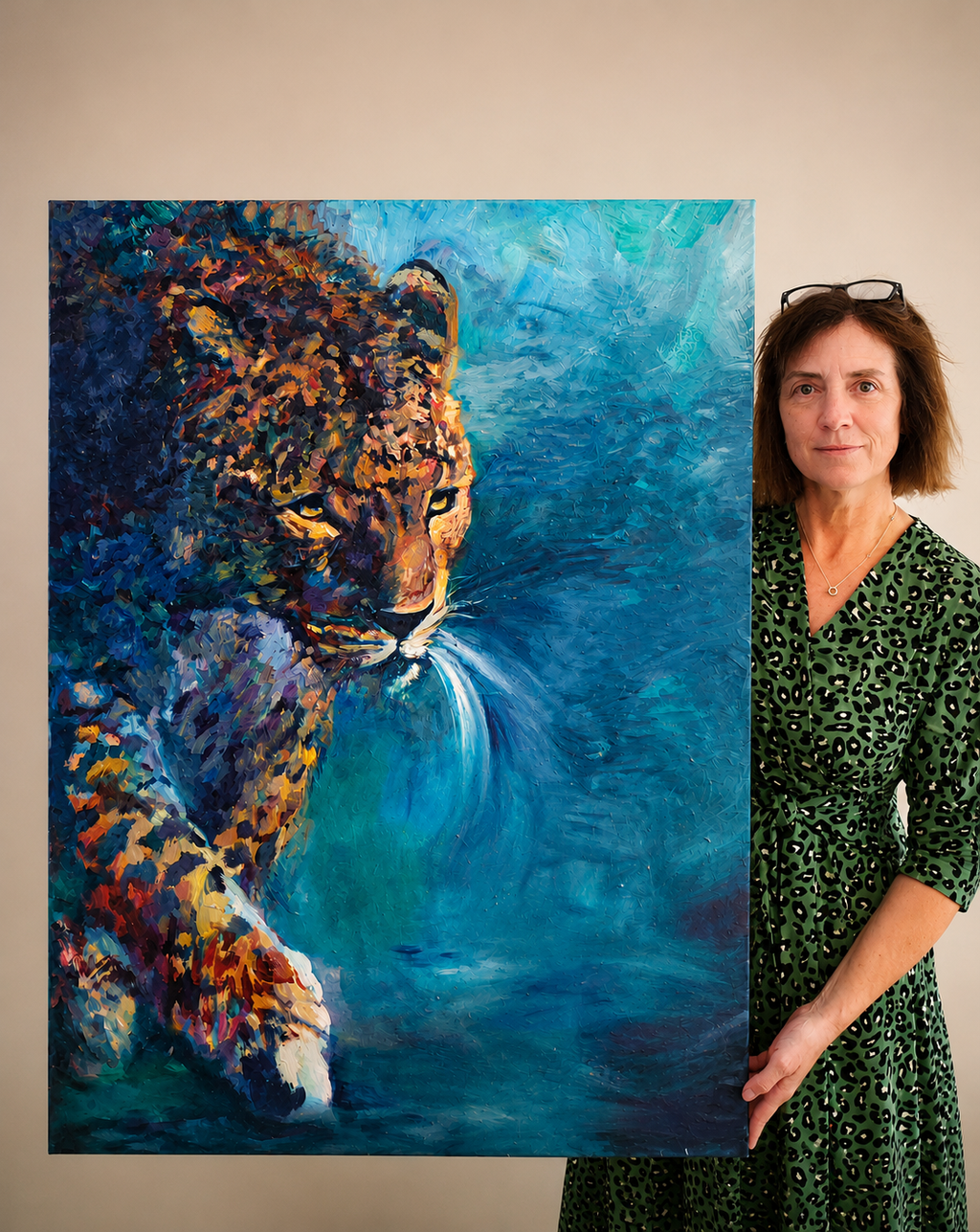 Woman standing next to a painting of a leopard with a blue and green abstract background