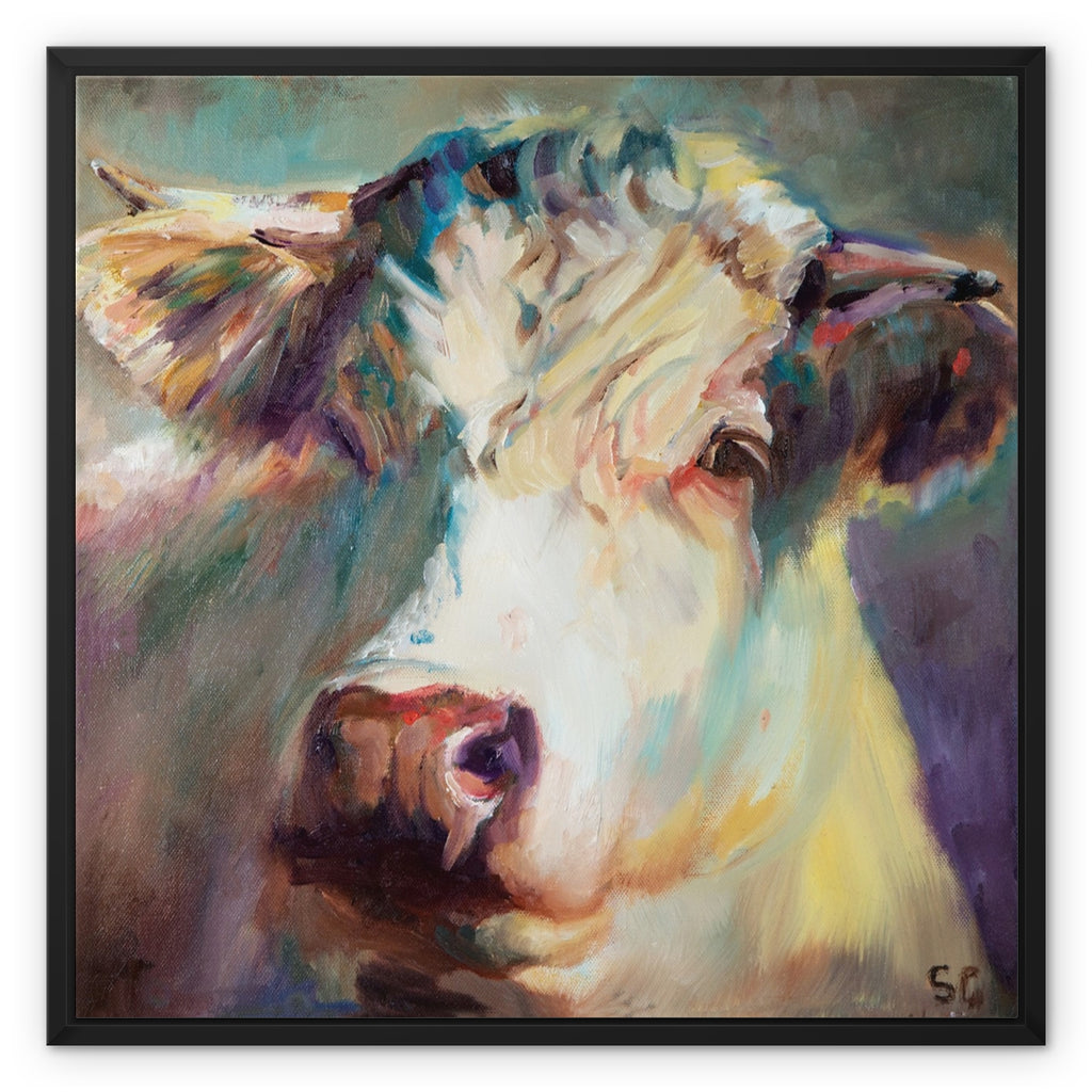 A framed square canvas painting of a cow's head, rendered in expressive painterly brushstrokes with a black frame on a white background.