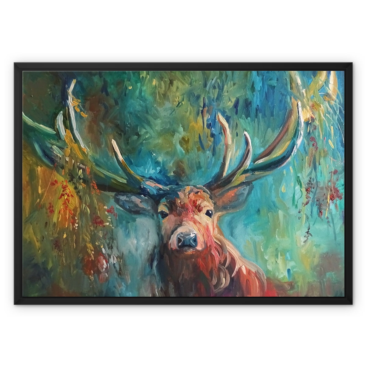 Framed canvas wall art featuring an expressive painting of a stag with large antlers against a vivid teal, green, and gold forest background, shown in a black frame on a white background.