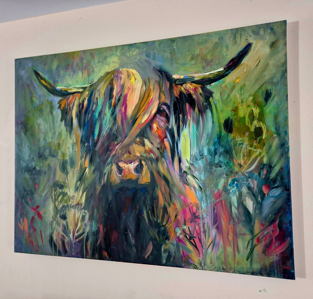 Colorful abstract painting of a cow in a field