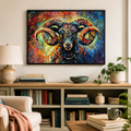 A colorful framed canvas painting of a ram's head hangs on a beige wall above a wooden console shelf in a styled living room setting.