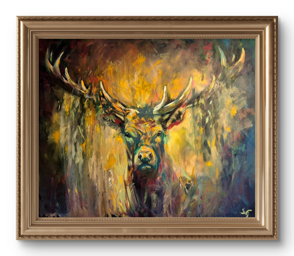 a big stag painting in shades of gold, brown and green, in a gold frame