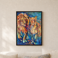 A framed colorful painting of two lions hanging on a beige wall above a sofa with neutral-toned pillows.