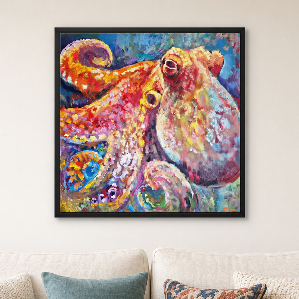 A colorful framed canvas painting of an octopus hanging on a light beige wall above a white sofa with decorative pillows.