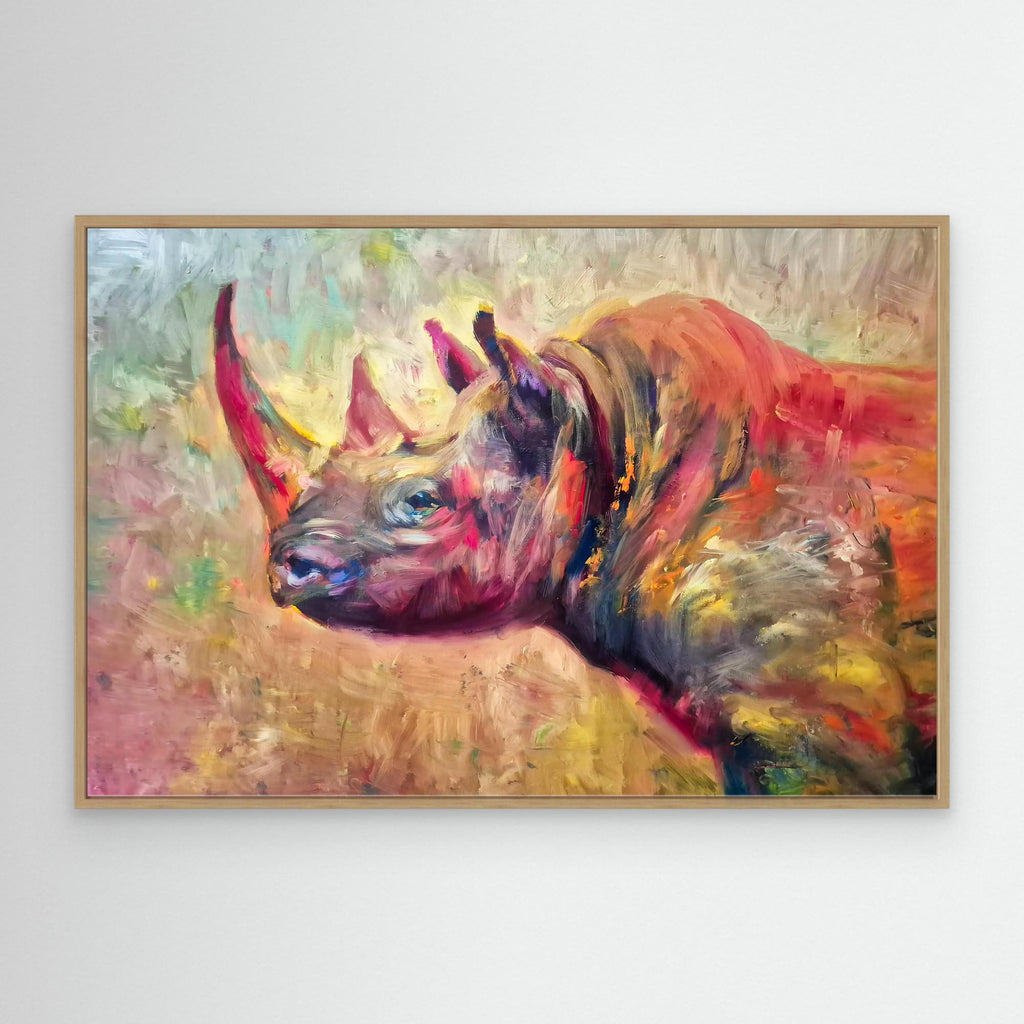 Colorful abstract painting of a rhinoceros on a white wall