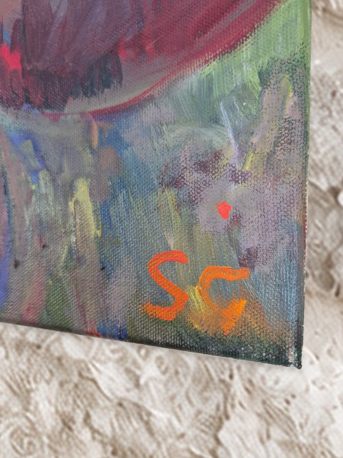 Susan Gardner’s painted signature and canvas texture on Rainbow Ripple.