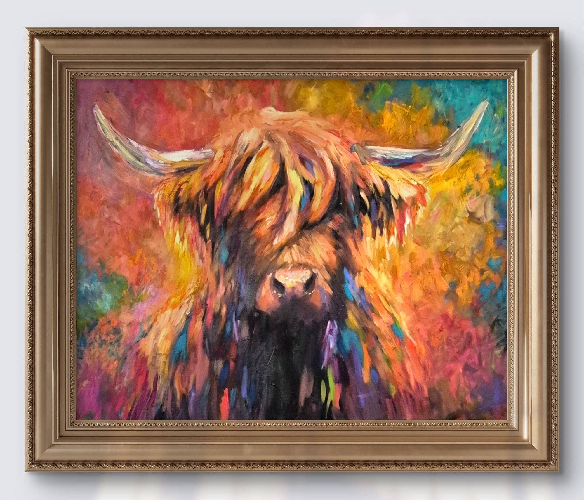 Framed colorful painting of a highland cow on a white wall
