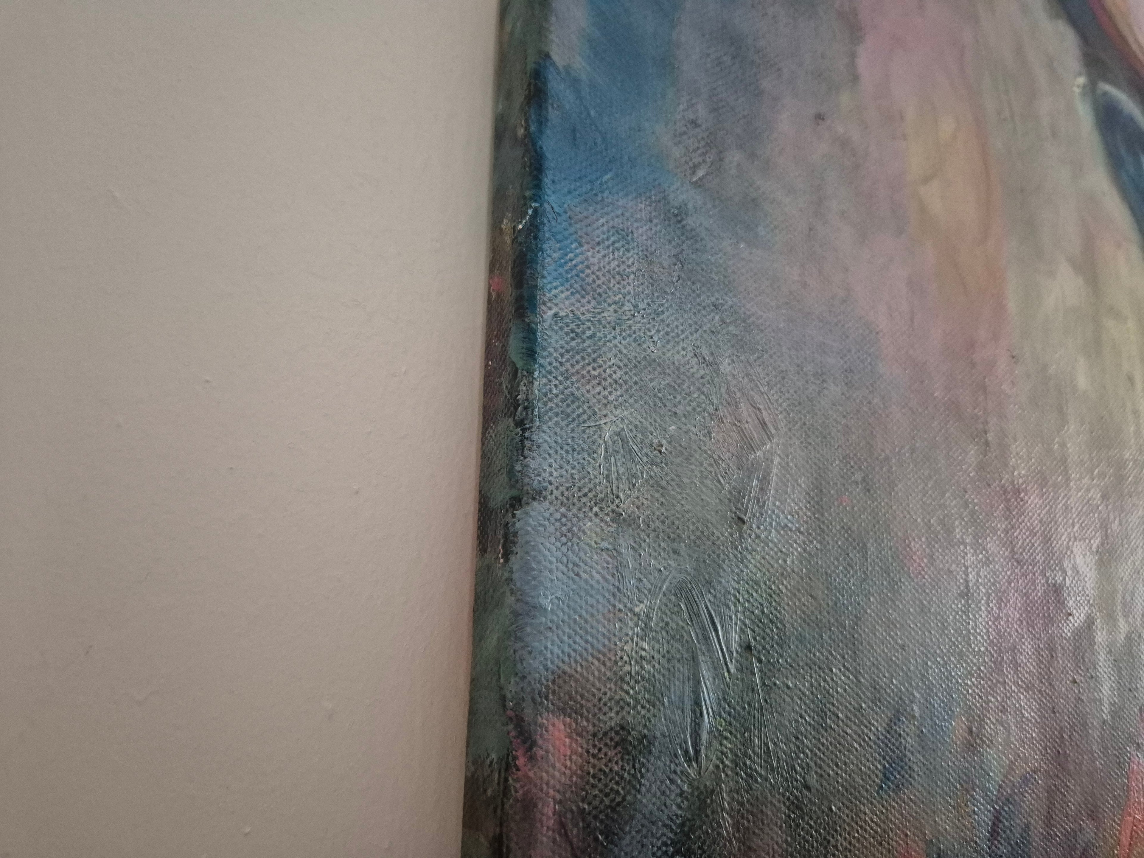 Close-up of a textured oil painting surface with a neutral background