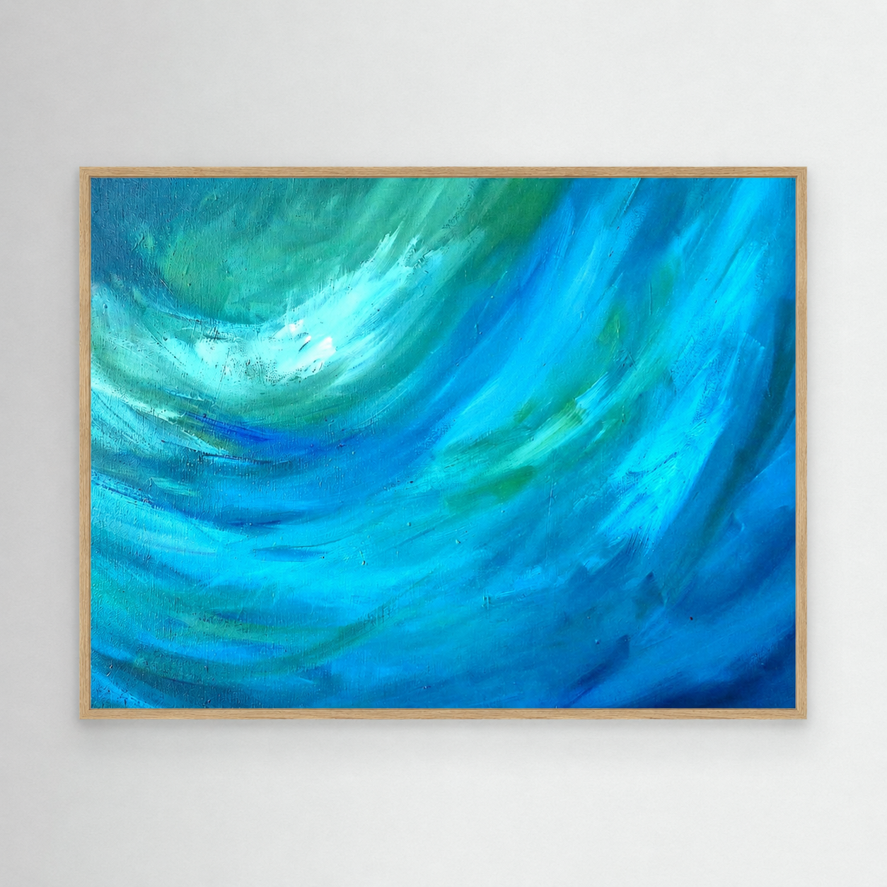 Framed abstract painting with swirling blue and green colors on a white wall.