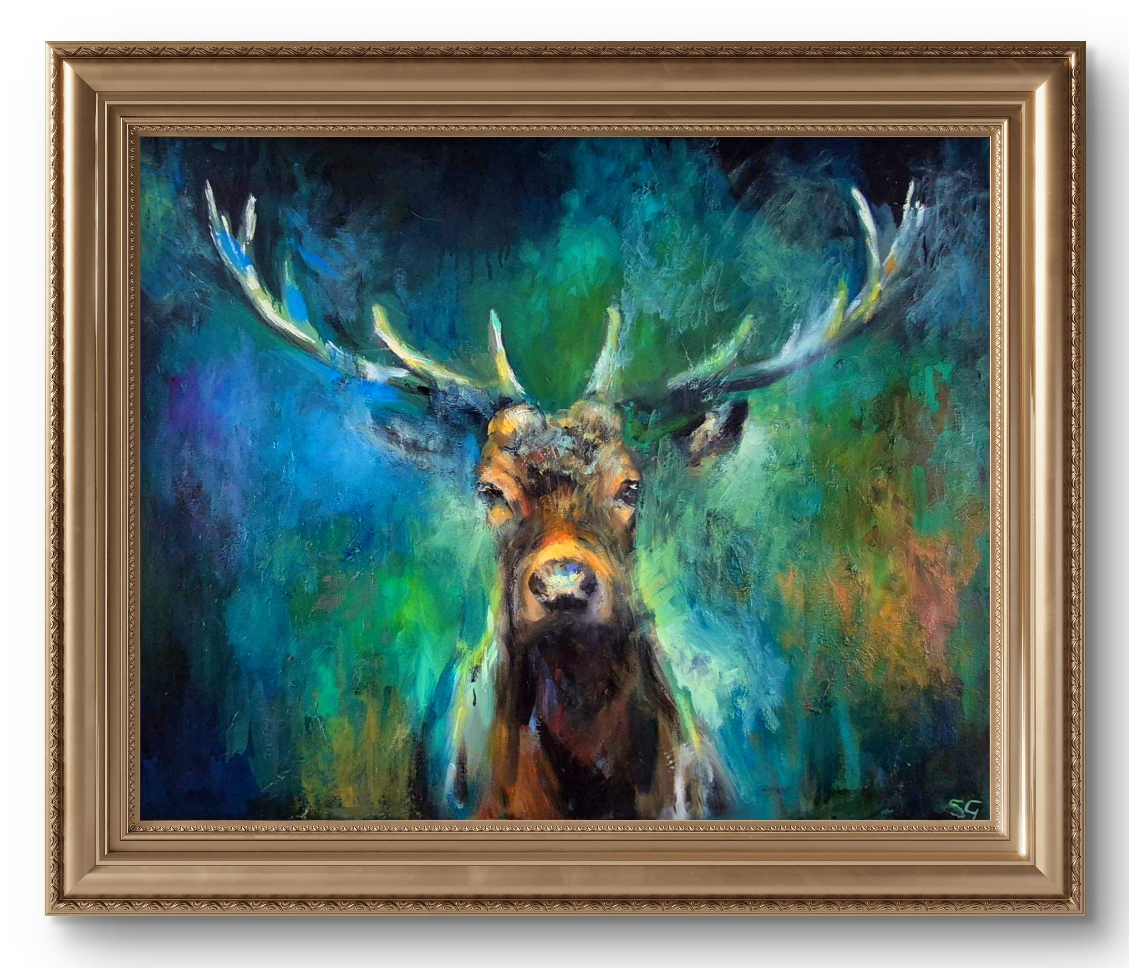 Framed painting of a deer with a colorful background