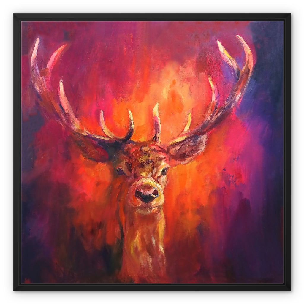 A framed canvas print of a vibrant painting featuring a deer with large antlers against a multicolored background.